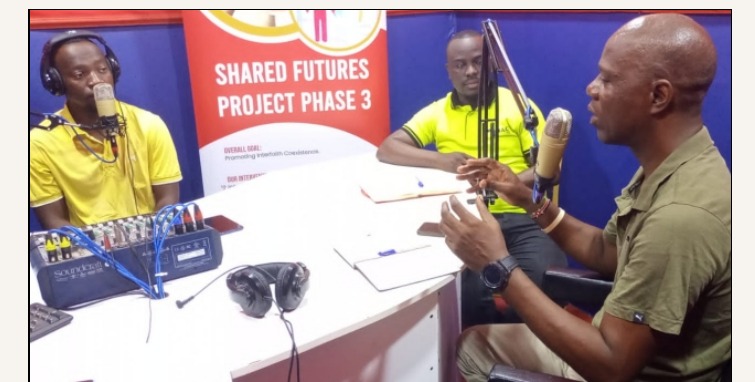 JAC FM presenters recording a community news interview